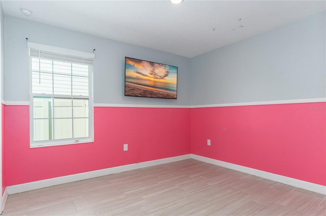 empty room with light hardwood / wood-style floors