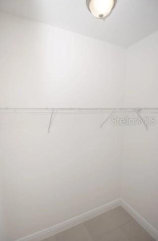 3179 W Barberton Pl, Citrus Springs, FL 34433 - walk in closet with light tile patterned floors