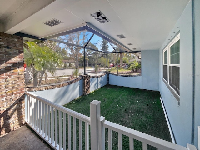 view of yard with glass enclosure