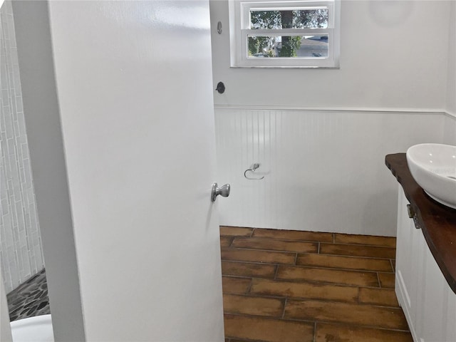 bathroom with vanity and a shower