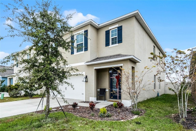 view of front of home with a front lawn and a garage