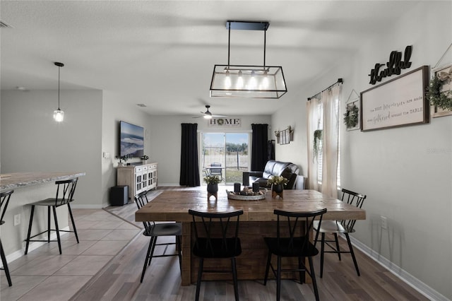 dining room featuring ceiling fan and light wood-type flooring