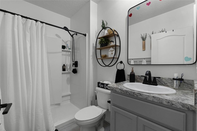 bathroom with toilet, vanity, a textured ceiling, and curtained shower