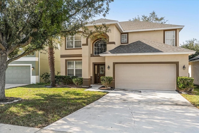 view of front of home with a front lawn and a garage