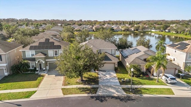 birds eye view of property with a water view