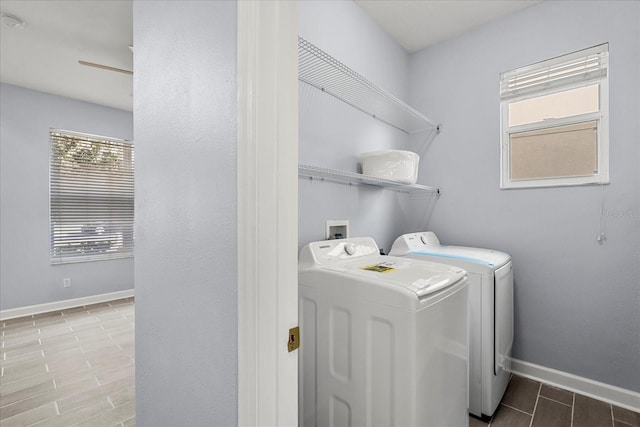 laundry area with washing machine and dryer and tile patterned flooring