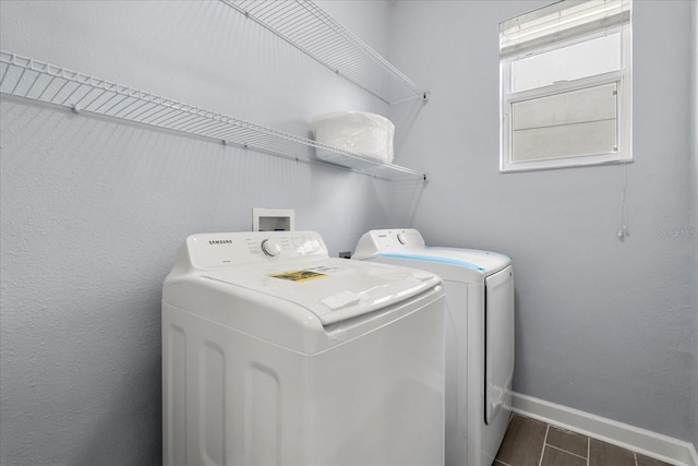 laundry area with washing machine and clothes dryer