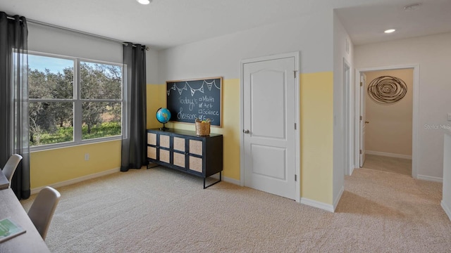 interior space featuring light carpet