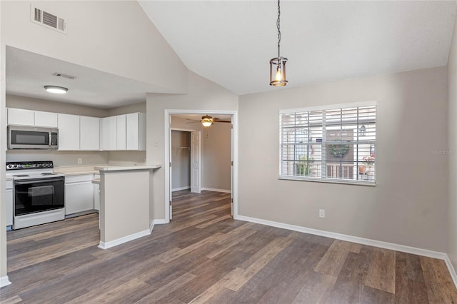 kitchen featuring pendant lighting, white electric range oven, dark hardwood / wood-style flooring, and white cabinetry