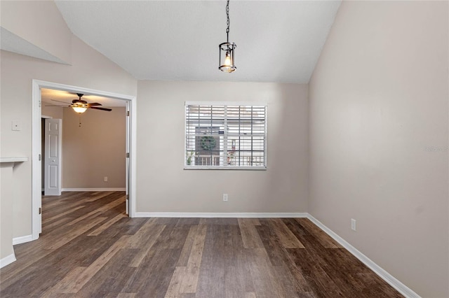 unfurnished dining area with ceiling fan, vaulted ceiling, and dark wood-type flooring