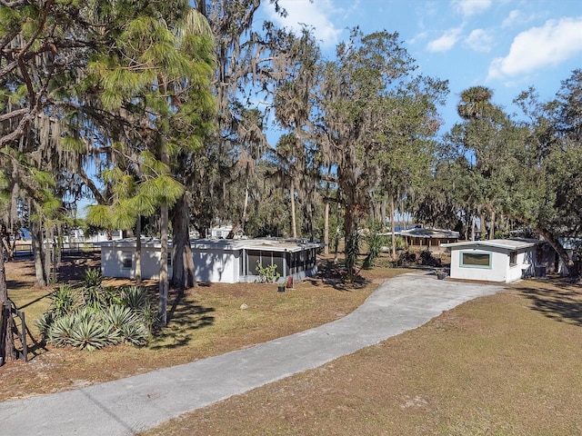 ranch-style house with a front lawn