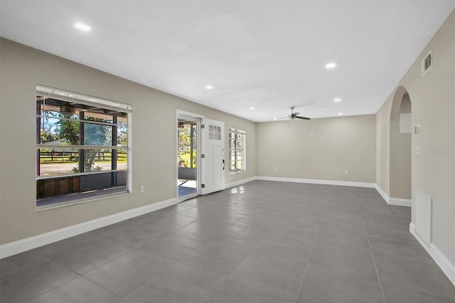 unfurnished room with ceiling fan