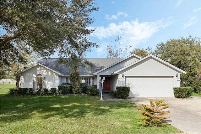 ranch-style home featuring a garage and a front lawn