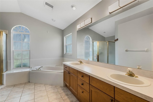 bathroom featuring tile patterned flooring, a wealth of natural light, lofted ceiling, and plus walk in shower