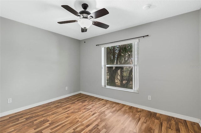 unfurnished room featuring ceiling fan and wood-type flooring