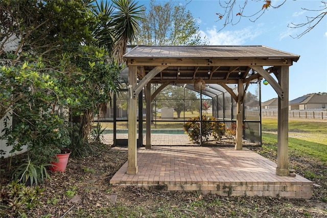 view of property's community featuring a pool and a patio