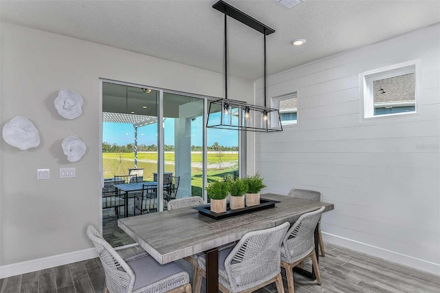 dining area with a textured ceiling