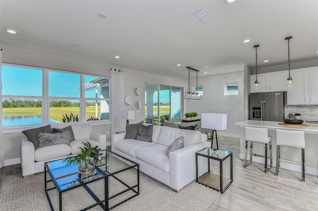 living room featuring a water view