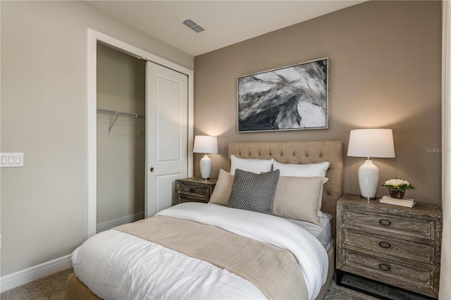 carpeted bedroom with a closet