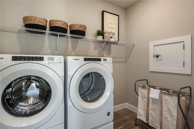 washroom featuring washer and clothes dryer and dark hardwood / wood-style flooring