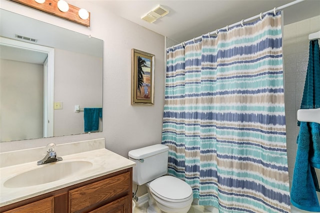 bathroom featuring toilet, vanity, and a shower with shower curtain