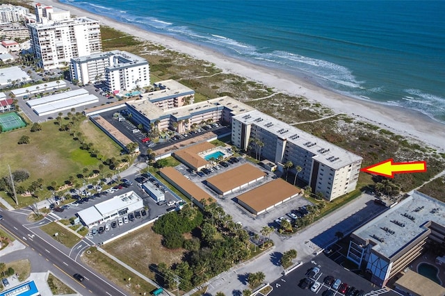 aerial view with a water view and a view of the beach