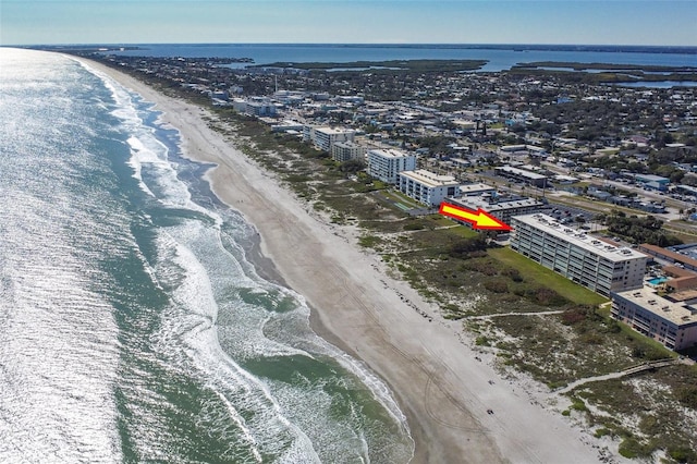 bird's eye view with a water view and a view of the beach