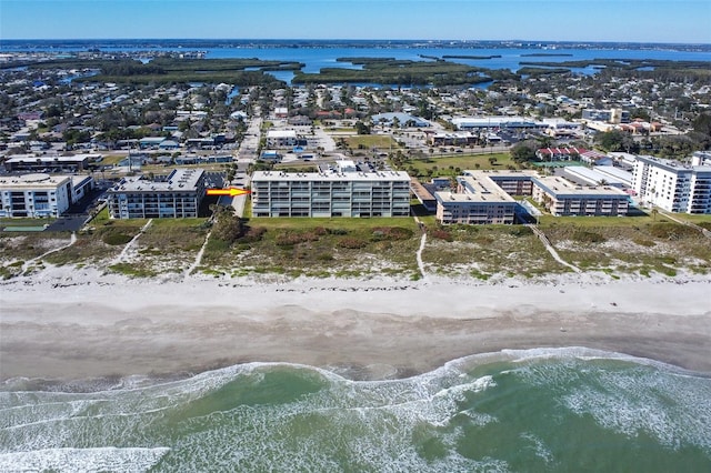 bird's eye view with a water view and a view of the beach