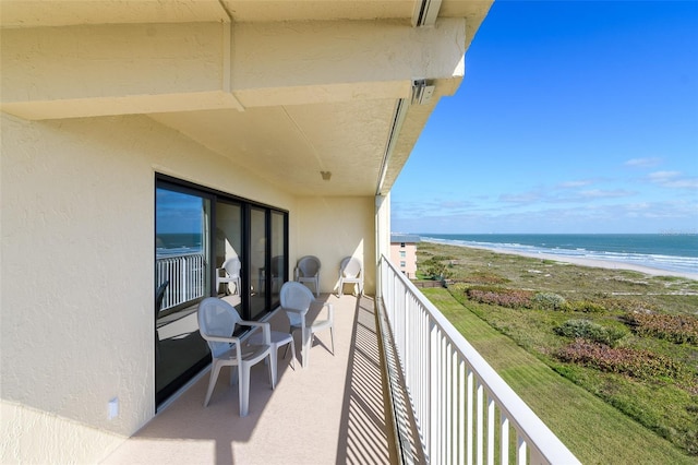 balcony with a view of the beach and a water view