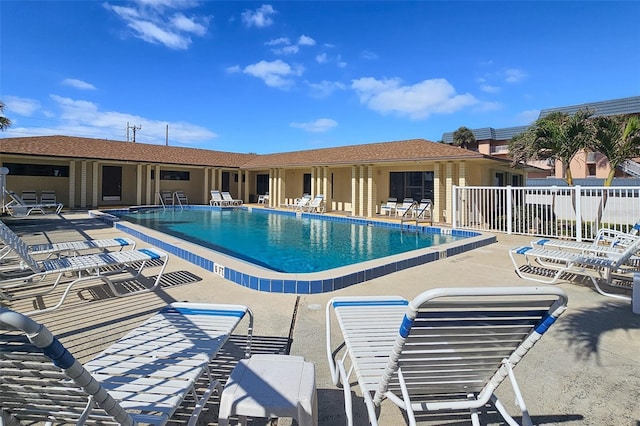 view of swimming pool with a patio