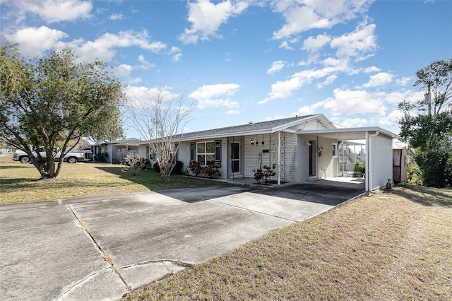 single story home featuring a carport and a front yard