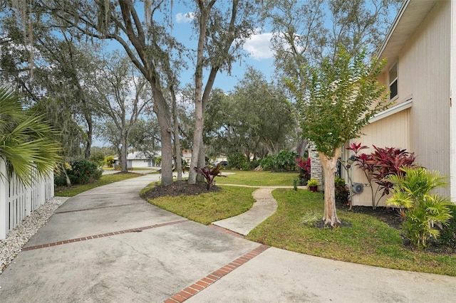 view of property's community featuring a yard