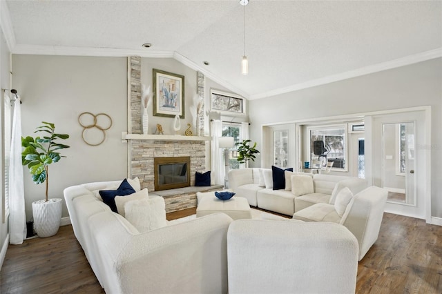 living room with lofted ceiling, dark hardwood / wood-style floors, a fireplace, crown molding, and a textured ceiling