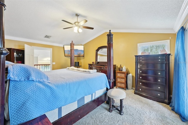 bedroom featuring ceiling fan, carpet floors, crown molding, and vaulted ceiling