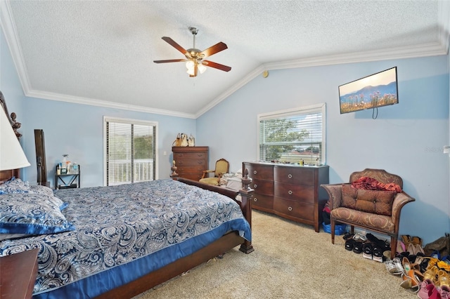 carpeted bedroom featuring vaulted ceiling, ceiling fan, ornamental molding, and a textured ceiling