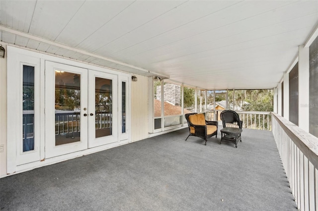 unfurnished sunroom featuring french doors