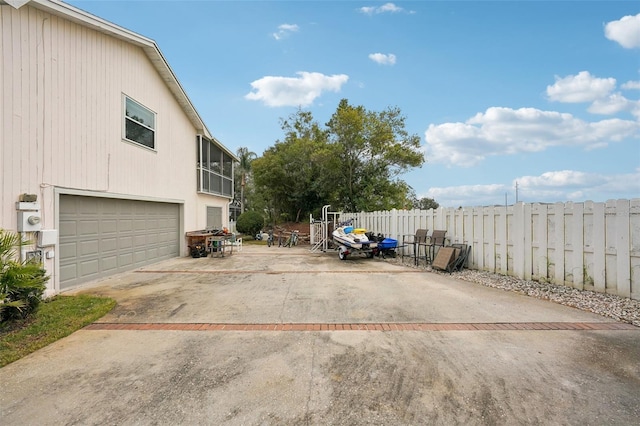 exterior space featuring a patio and a garage