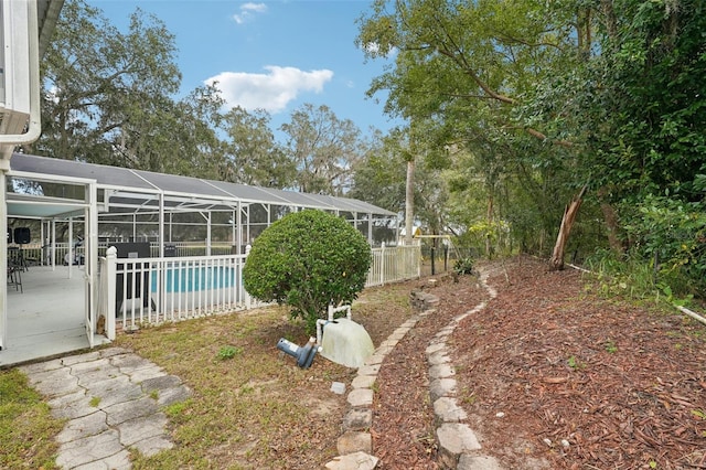 view of yard with a lanai and a patio