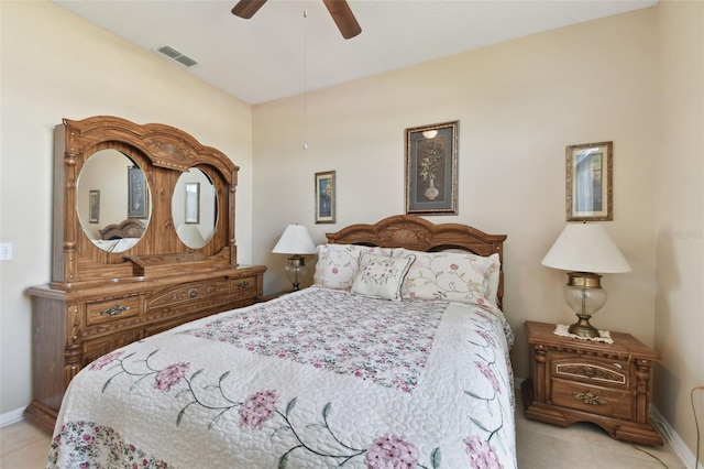 tiled bedroom with visible vents, baseboards, and a ceiling fan