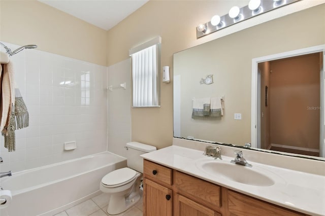 bathroom featuring tile patterned floors, toilet, bathtub / shower combination, and vanity