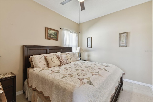 bedroom with ceiling fan, baseboards, and light tile patterned flooring