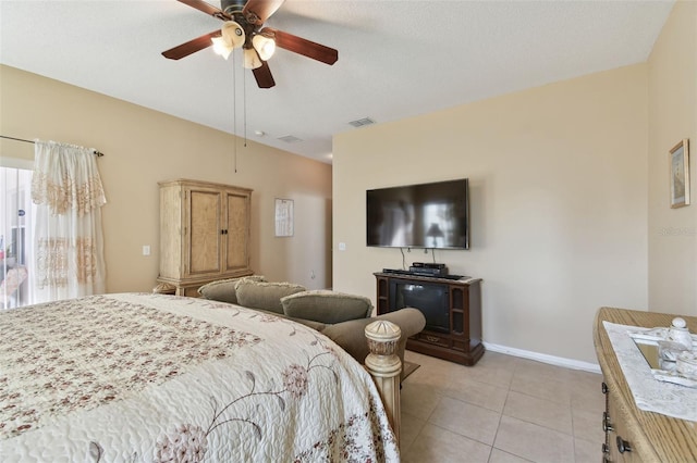 bedroom featuring visible vents, baseboards, light tile patterned flooring, and a ceiling fan