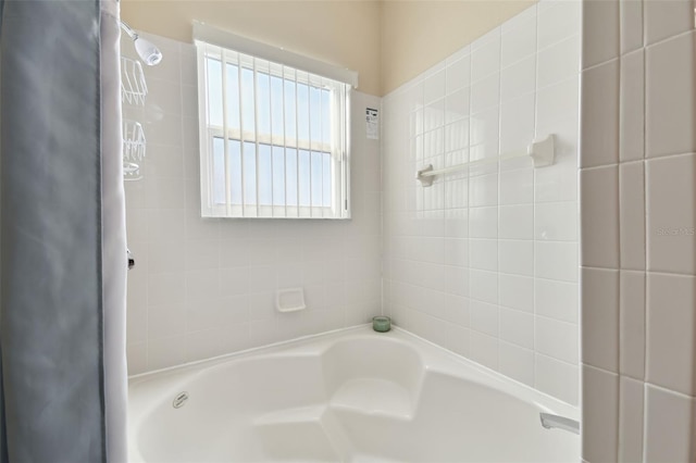 full bath featuring a shower and a tub