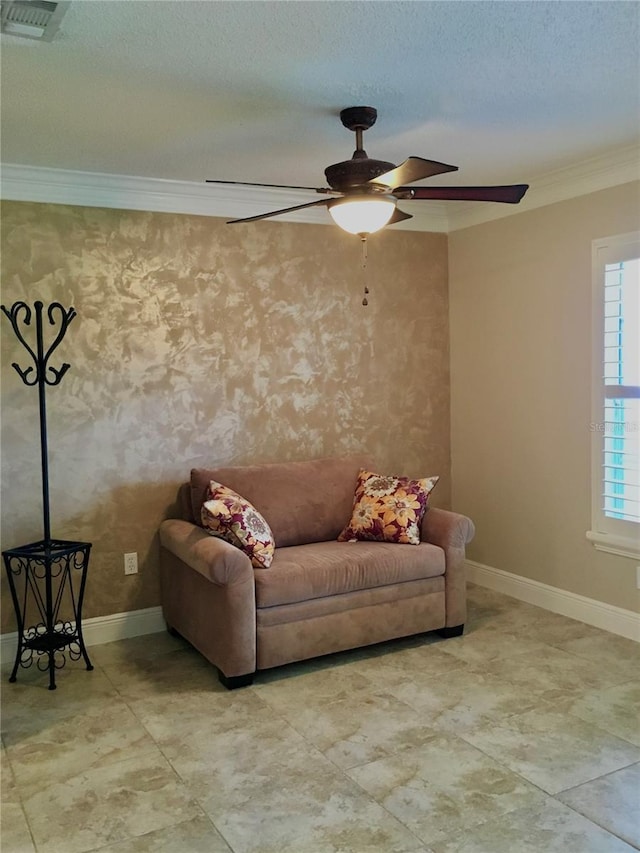 living room with ornamental molding and a textured ceiling