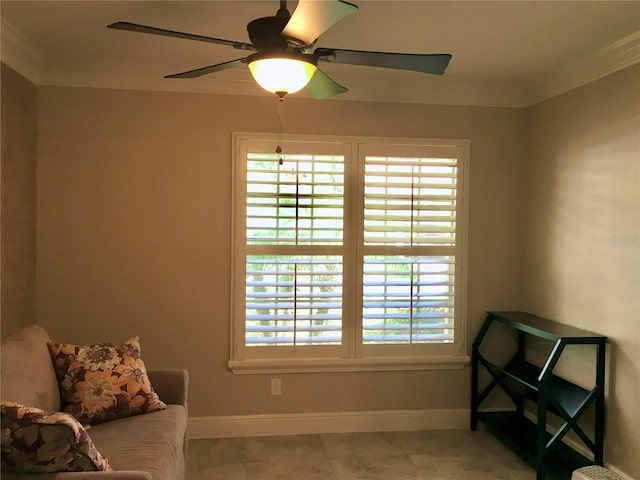 sitting room with ceiling fan, crown molding, and light tile patterned floors