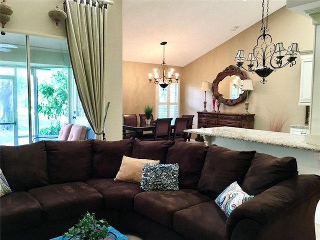 living room featuring a chandelier and lofted ceiling