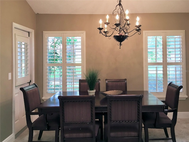 dining space with a notable chandelier