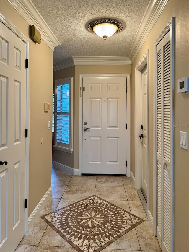 entrance foyer with crown molding and a textured ceiling