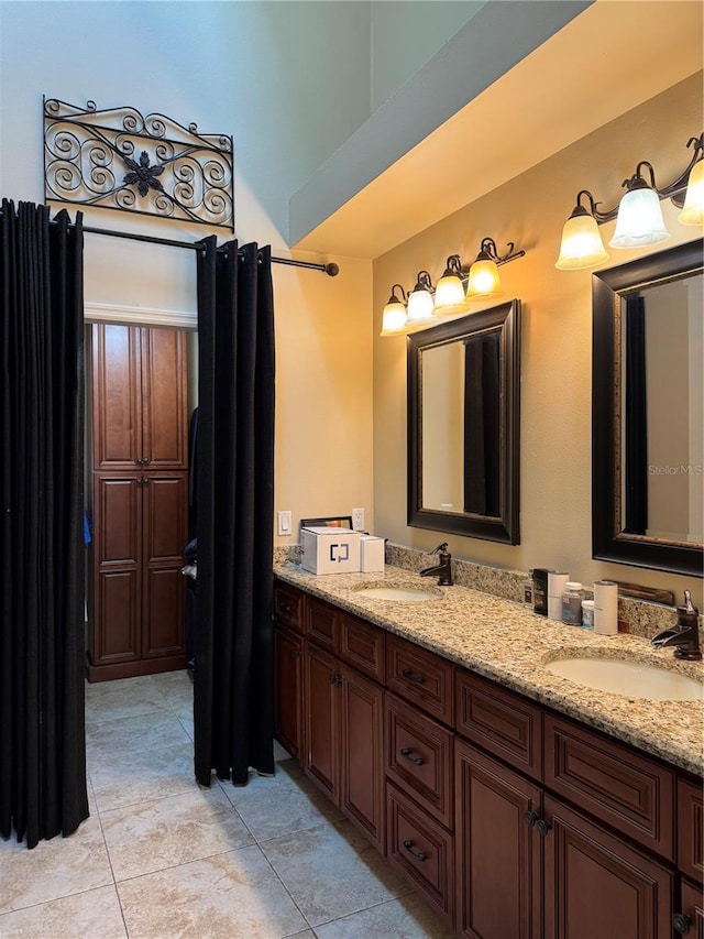 bathroom with vanity and tile patterned flooring