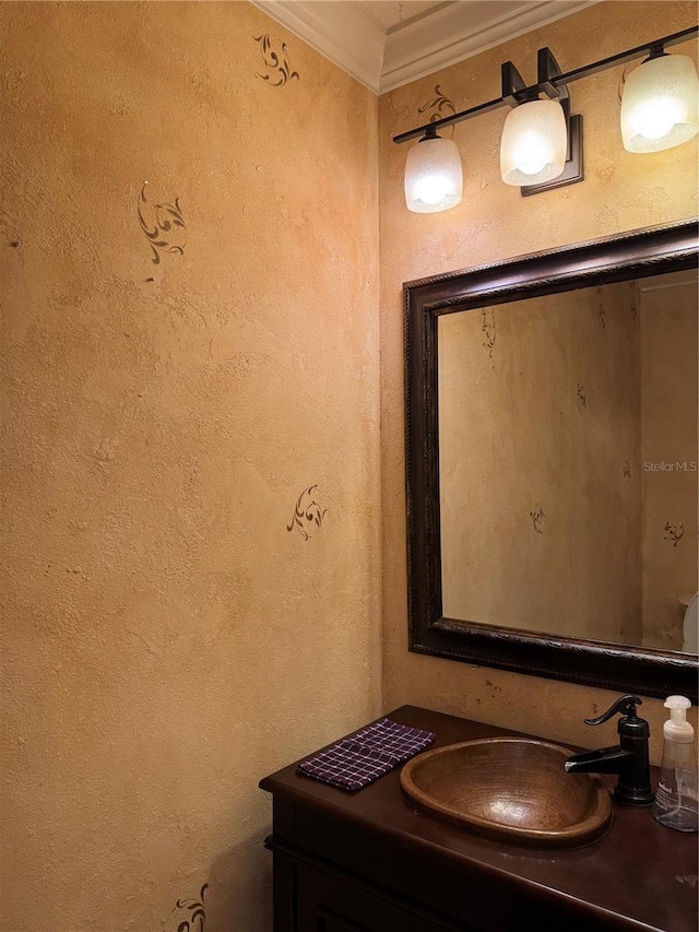 bathroom with vanity and crown molding